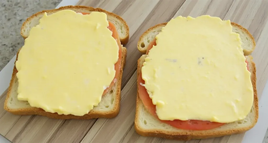 Spread butter generously on one side of each bread slice.
