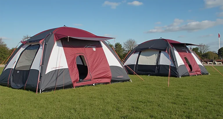 Family camping with an inflatable tent set up at a scenic outdoor location.