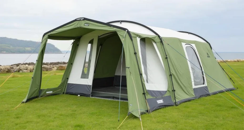 Vango Odyssey Air 800 inflatable tent with air beam system, integrated canopy, and separate sleeping pods for families.