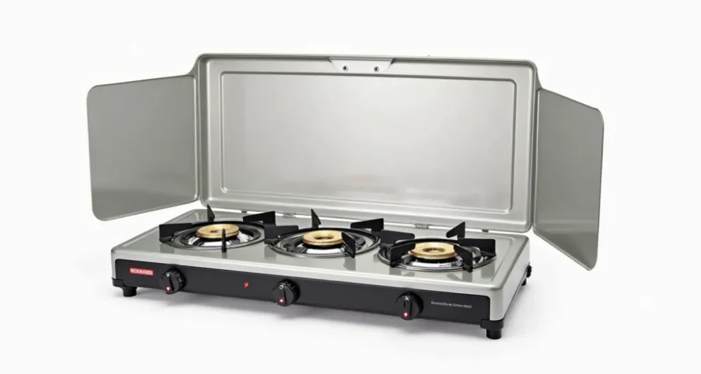 Camping stove with three burners and wind guards, ideal for family trips.