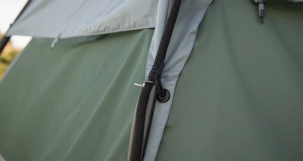 Durable 3-room tent materials and sturdy aluminum poles for wind resistance.